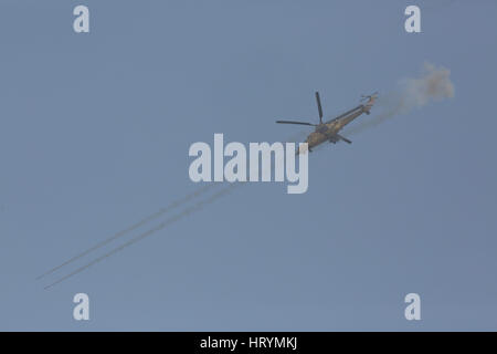 Mosul, Nineveh, Iraq. 1st Mar, 2017. An Iraqi Military MI-35M Attack Helicopter fires rockets against ISIS positions in the Wadi Hajjar neighborhood of Western mosul, Mar 1, 2017. Helicopters were called in to support troops fighting on the ground against determined ISIS opposition. Credit: Nish Nalbandian/ZUMA Wire/Alamy Live News Stock Photo