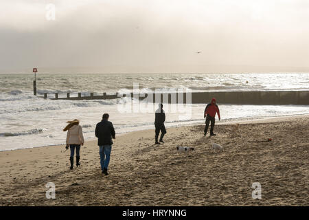 Boscombe, Bournemouth, Dorset, UK. 5th March, 2017. People on the in windy weather. Stock Photo