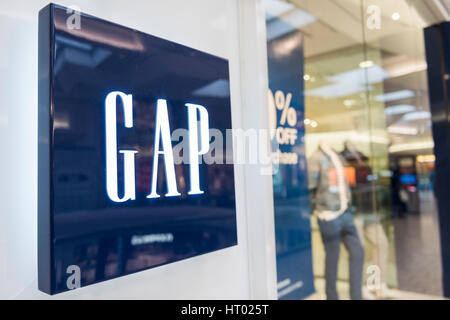 Fairfax, USA - February 18, 2017: Gap storefront with logo by entrance Stock Photo