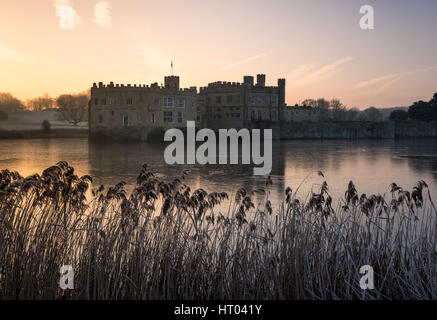 Colourful sunrise at Leeds Castle, Kent on a Winter's morning. Stock Photo