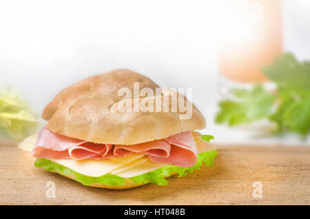 sandwich with ham,  cheese and green lettuce on white background Stock Photo