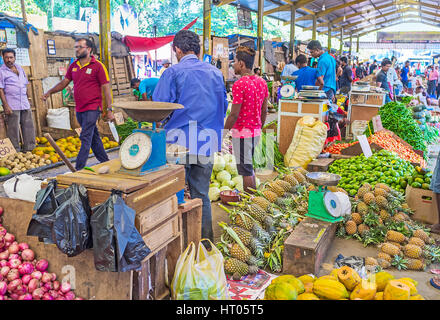 COLOMBO, SRI LANKA - DECEMBER 6, 2016: The best way to discover Sri Lankan exotic fruits and vegetables is to visit Fose Market in Pettah, on December Stock Photo