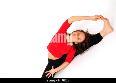 Junge Frau beim Dehnen - young woman does stretching Stock Photo