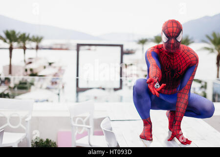 TIVAT, MONTENEGRO - AUG 4, 2015:  Cosplayer dressed as Spiderman in cafe of TIvat. Spider man is a fictional character created by Stan Lee Stock Photo