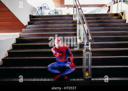 TIVAT, MONTENEGRO - AUG 4, 2015:  Cosplayer dressed as Spiderman in cafe of TIvat. Spider man is a fictional character created by Stan Lee Stock Photo