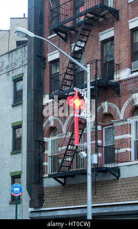 Red icons hanging in the streets of Chinatown in New York City; the rounded sides mean this good fortune is to be shared with all Stock Photo