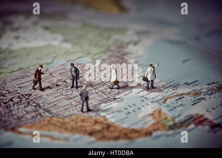 Miniature business people on top of US map. Business concept. Color tone tuned Stock Photo