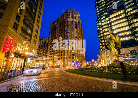 Modern buildings and the National Katyń Memorial at night, in Harbor East, Baltimore, Maryland. Stock Photo