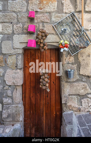 Largentiere, France, September 17, 2015: IImage of an old shop door in a street in the center of Largentiere in the Ardeche region of France Stock Photo