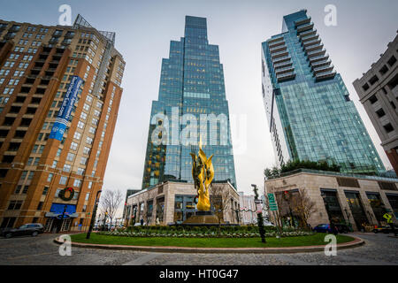 The National Katyń Memorial and modern buildings in Harbor East, Baltimore, Maryland. Stock Photo