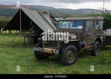 Restored Willys Jeep and American miltary tents in a field at Rhug North Wales Stock Photo