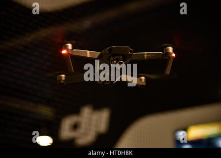 Close up of DJI Mavic Pro consumer drone in flight in the DJI netted exhibit booth at the CES 2017.  Video, photography, flight, surveillance. Stock Photo