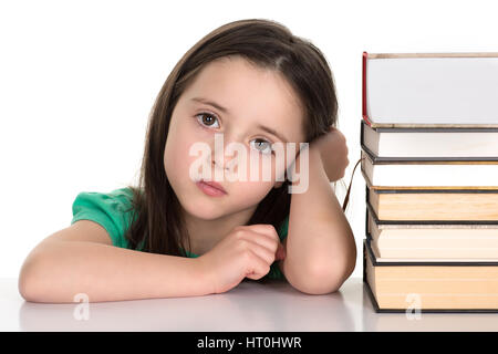 Student girl sitting on pile of books Stock Photo - Alamy