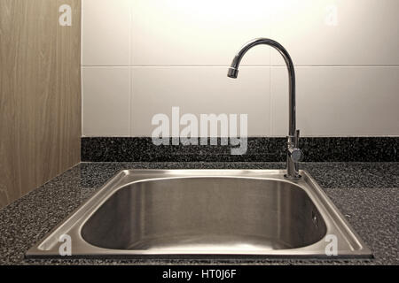 kitchen sink and faucet on marble counter Stock Photo