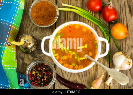 Soup in white bowl on wooden background. Stock Photo