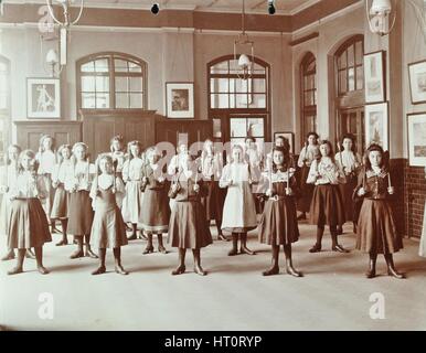 Girls holding Indian clubs, Cromer Street School/ Argyle School, St Pancras, London, 1906. Artist: Unknown. Stock Photo