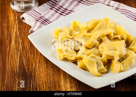 Tortellini shells filled with chesse Stock Photo