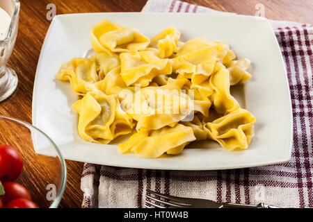 Tortellini shells filled with chesse Stock Photo