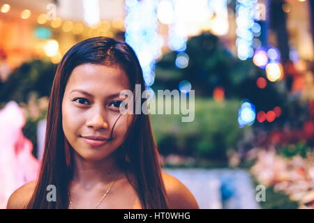 baeutiful girl in a city park,night vew chrismas season Stock Photo