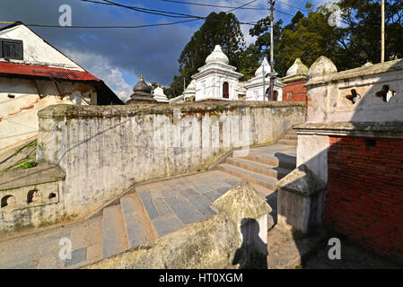 PASHUPATINATH - OCTOBER : Cremation ghats and ceremony along the holy Bagmati River. Hundreds of earthquake victims were cremated here after the catas Stock Photo