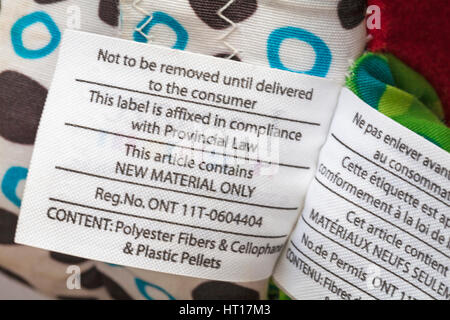 Not to be removed until delivered to the consumer this label is affixed in compliance with Provincial Law, info on label on Lamaze Trotter the pony toy Stock Photo
