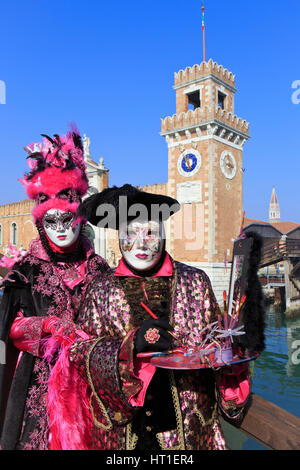 A costumed painter and his wife at the Venitian Arsenal during the Carnival in Venice, Italy Stock Photo