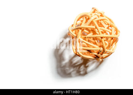 A wicker ball with strong shadow, isolated on white. Free space for text. Stock Photo