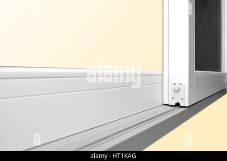 Sliding glass door detail and rail embed in wooden floor Stock Photo