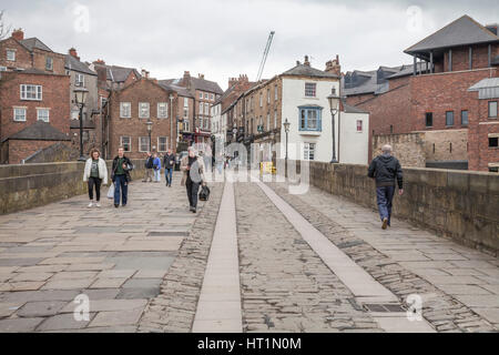 People walking across Old Elvet bridge in Durham city center,England,UK Stock Photo