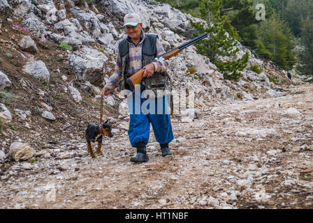 hunter with his dog and gun hunting Stock Photo