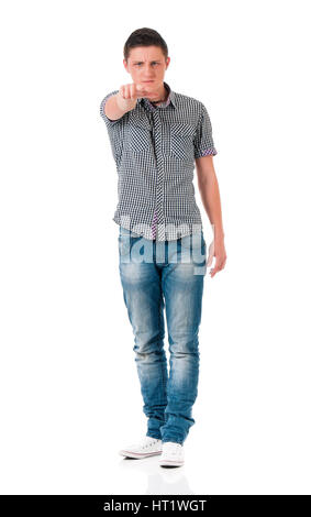 Teen boy pointing at camera choosing you, isolated on white background. Caucasian young man pointing finger to you. Stock Photo