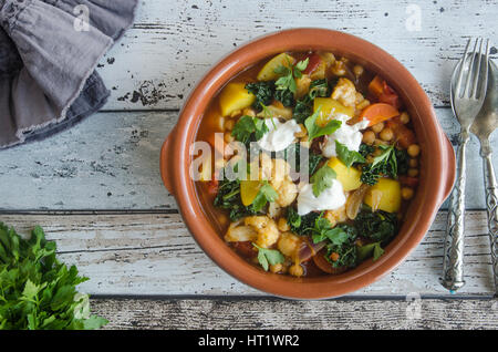 Moroccan chickpea and cauliflower tagine with couscous Stock Photo