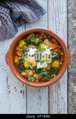 Moroccan chickpea and cauliflower tagine with couscous Stock Photo