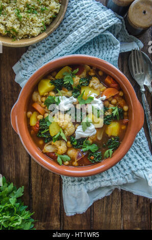 Moroccan chickpea and cauliflower tagine with couscous Stock Photo