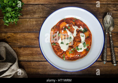 Pork and paprika goulash with soured cream Stock Photo