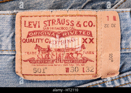 BANGKOK, THAILAND - DECEMBER 09 2014: Close up of the LEVI'S leather label on the old blue jeans. LEVI'S is a brand name of Levi Strauss and Co, found Stock Photo
