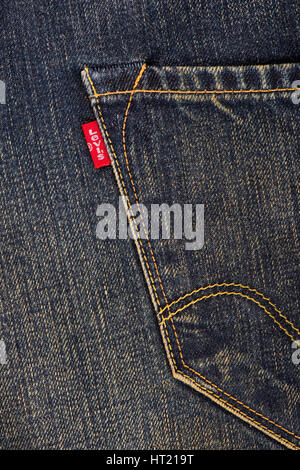 BANGKOK, THAILAND - DECEMBER 09 2014: Close up of the LEVI'S red label on the back pocket of denim jeans. LEVI'S is a brand name of Levi Strauss and C Stock Photo