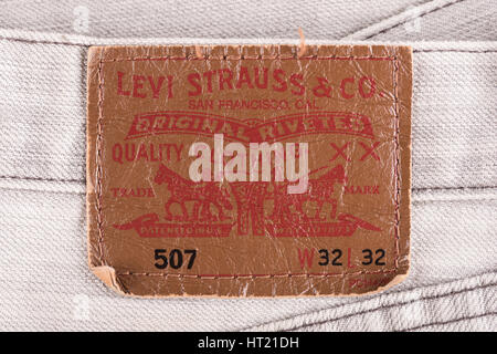 BANGKOK, THAILAND - DECEMBER 09 2014: Close up of the LEVI'S leather label on the old gray jeans. LEVI'S is a brand name of Levi Strauss and Co, found Stock Photo