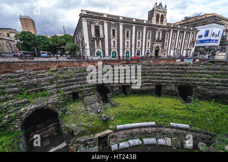 Tezzano Palace and Ruins of Roman Amphitheatre at Piazza Stesicoro (Stesicoro Square) in Catania city on the east side of Sicily Island, Italy Stock Photo