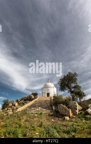 Wispy clouds above the steps leading to a large white domed mausoleum at Palasca in the Balagne region of Corsica Stock Photo