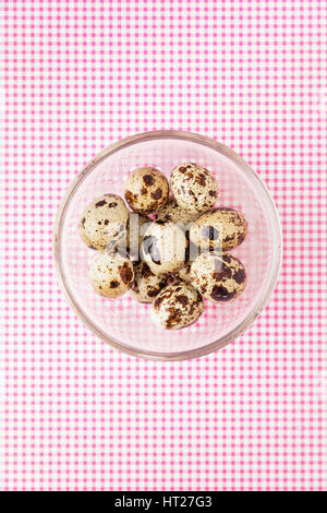 Quail Eggs In A Glass Bowl Top View Stock Photo