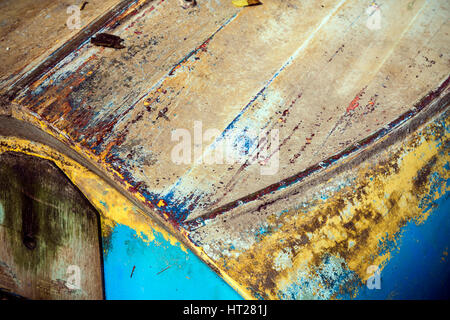 Row boat upturned at  the Devon village of Stoke Gabriel South Hams Devon,multi coloured hull, Stock Photo
