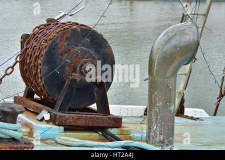 Detail of rusty chain winch on board of commercial fishing vessel. Stock Photo