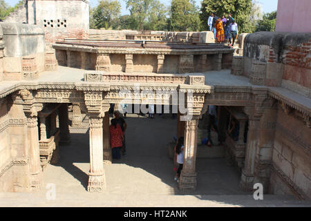 View of the Western entrance from top. Tourists at Adalaj Stepwell in Ahmedabad, Gujarat, India .The stepwell was built in 1498 by king Mohammed Begda Stock Photo