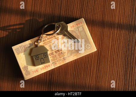House keychain with Indian notes or currency Stock Photo
