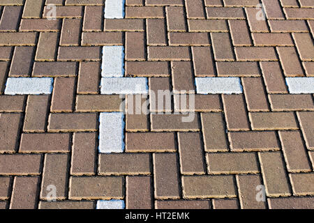 Abstract herringbone block paving in a car park pattern Stock Photo