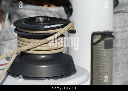 Details of winch and rope on sailing boat racer, boating concept Stock Photo