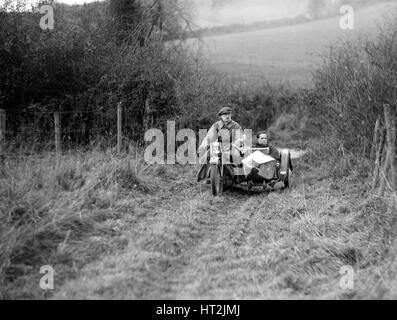 Motorcycle and sidecar competing in a motoring trial 