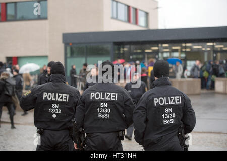 Dresden, Germany. 7th Mar, 2017. Police officers stand outside the correctional facility in Dresden, Germany, 7 March 2017. On the same day, the high security buildings, one of which is being converted into an initial accommodation unit for refugees, will host the German state of Saxony's judiaciary's first terrorism trial against suspected members of the 'Freital Group'. Credit: dpa picture alliance/Alamy Live News Stock Photo