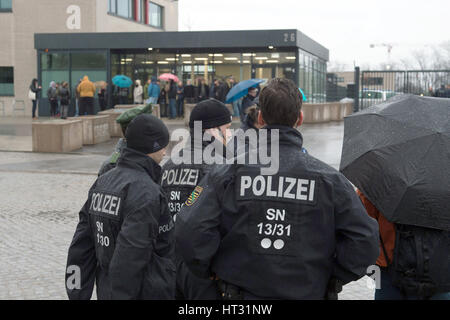 Dresden, Germany. 7th Mar, 2017. Police officers stand outside the correctional facility in Dresden, Germany, 7 March 2017. On the same day, the high security buildings, one of which is being converted into an initial accommodation unit for refugees, will host the German state of Saxony's judiaciary's first terrorism trial against suspected members of the 'Freital Group'. Credit: dpa picture alliance/Alamy Live News Stock Photo